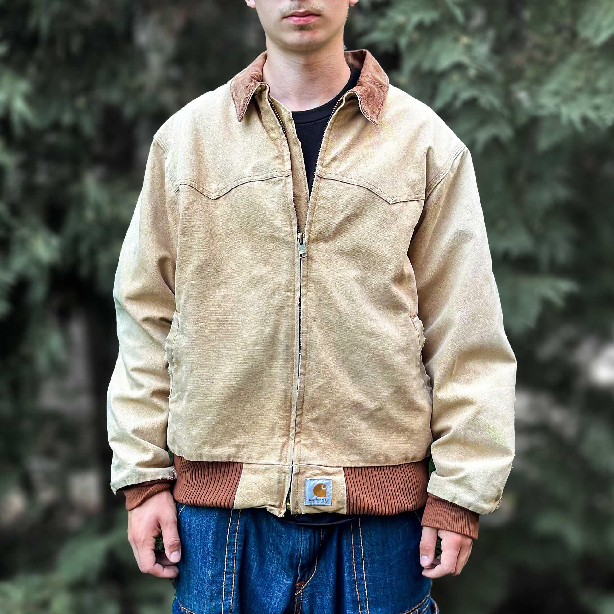 Man standing outside wearing a vintage Carhartt jacket